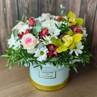 A Beautiful Distraction flower box with roses orchids alstroemeria chrysanthemums and greenery