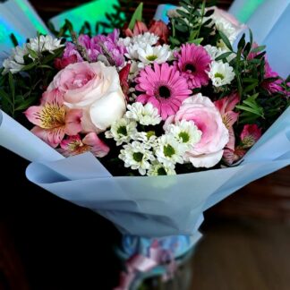 Fog of Dreams bouquet with pink roses gerberas alstroemeria chrysanthemums and blue wrapping