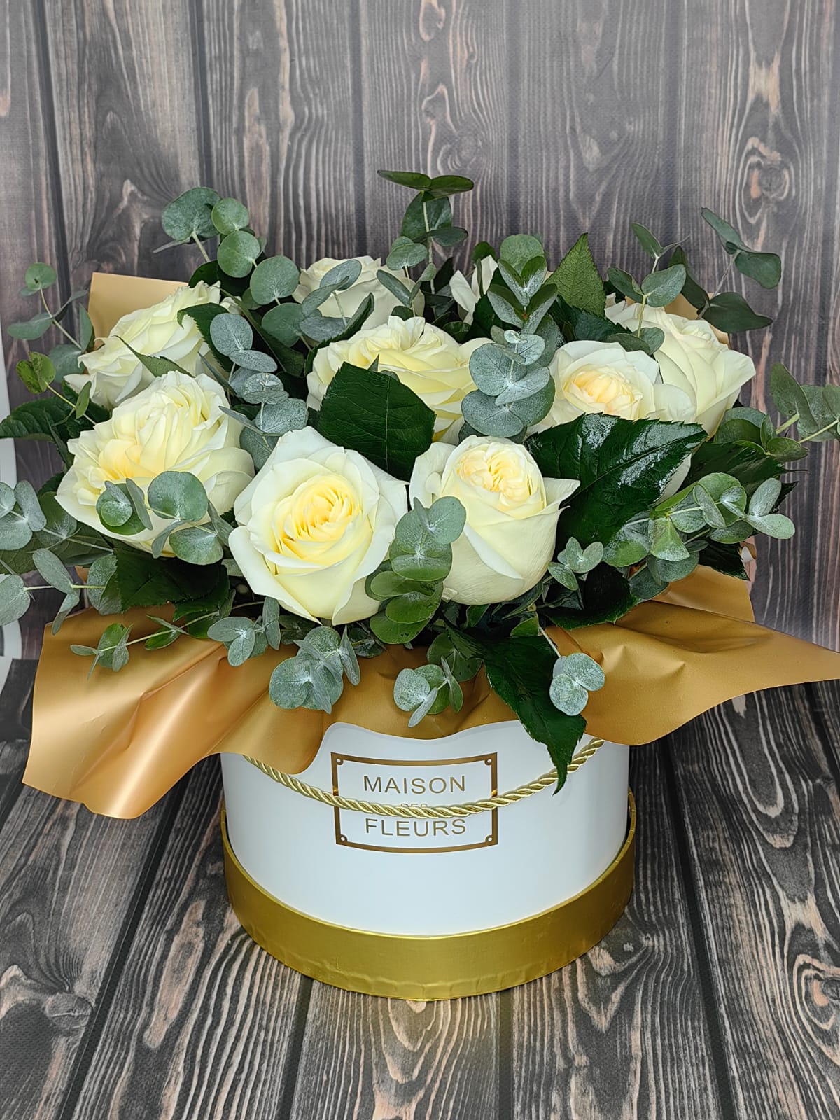 Gilded Dawn white rose flower box with eucalyptus fresh greenery and golden accents