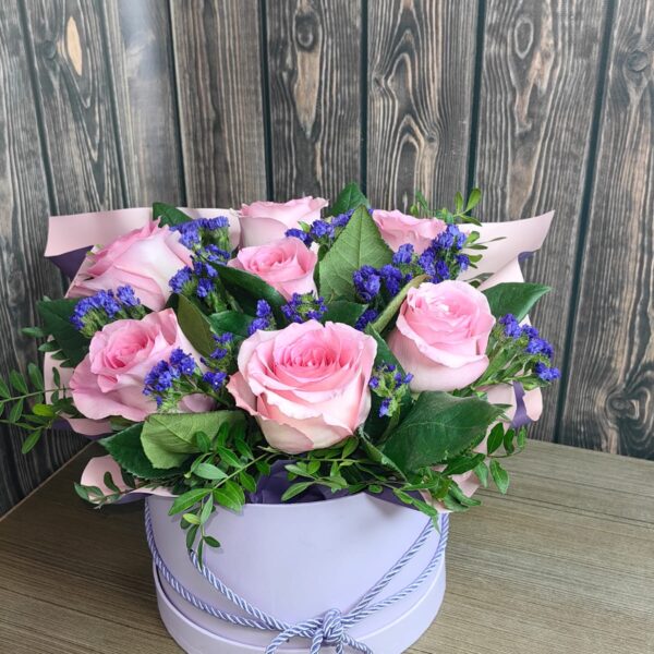 Pink in the Mist flower box with pink roses lilac statice and fresh decorative greenery
