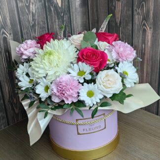 Petal Daydream pink flower bouquet with roses, carnations, chrysanthemums and daisies in a hat box