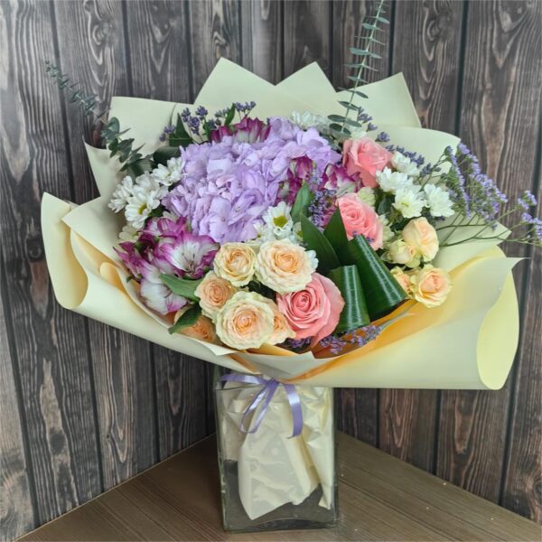 Tenderness pink hydrangea and spray rose bouquet with alstroemeria eucalyptus and pastel wrapping