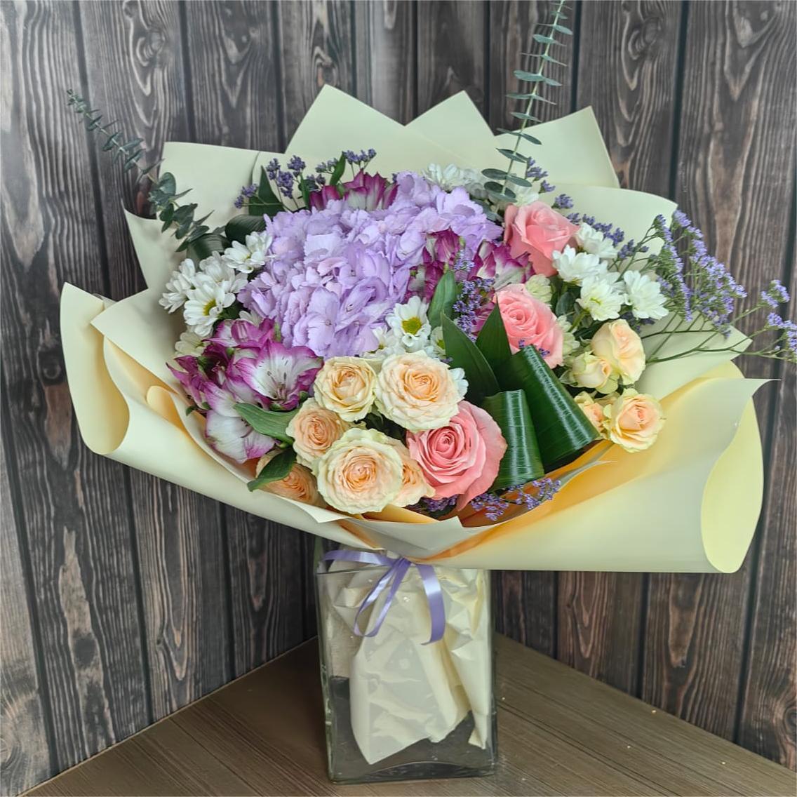 Tenderness pink hydrangea and spray rose bouquet with alstroemeria eucalyptus and pastel wrapping