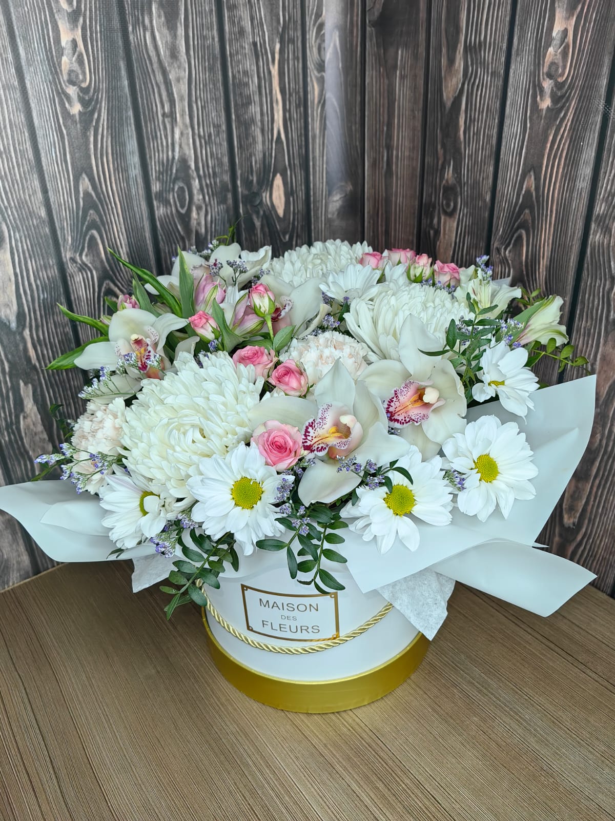 Elegant Bloom Box with orchids, chrysanthemums, roses and greenery in a stylish flower box