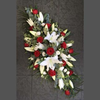 Funeral Bouquet with White Lilies, Red Roses, Eucalyptus, and Palm Leaves