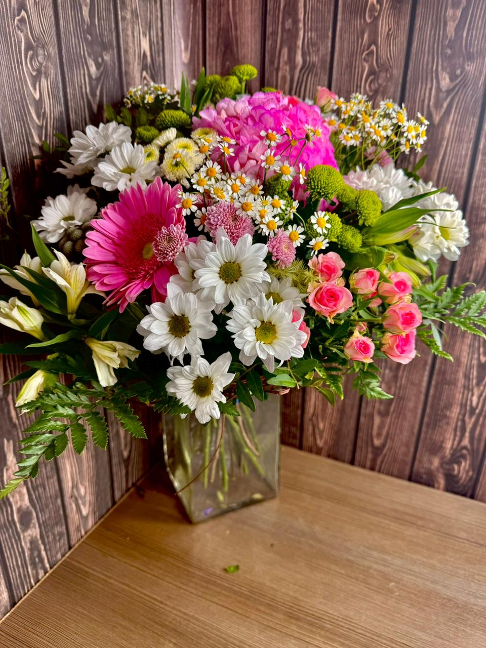 Summer bouquet with hydrangea, spray roses and daisies