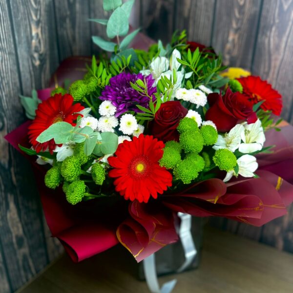 Bold Spirit bouquet with red roses, gerberas, chrysanthemums, alstroemeria and eucalyptus