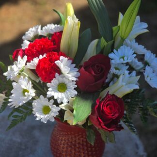 A bouquet in a glass vase: passion, nobility, and longevity