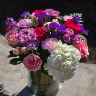 "Spring mood" bouquet with hydrangea, roses, and cornflowers