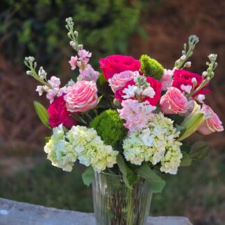 A bouquet in a glass vase with hydrangea, dianthus, pink matthiola, rose and lily – aristocratic tenderness for the most touching moments