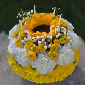 A cake bouquet on a floral foam with yellow spray chrysanthemum, white carnation, lily, sunflower, fern and candles – a celebration of light, color and aroma (Copy)