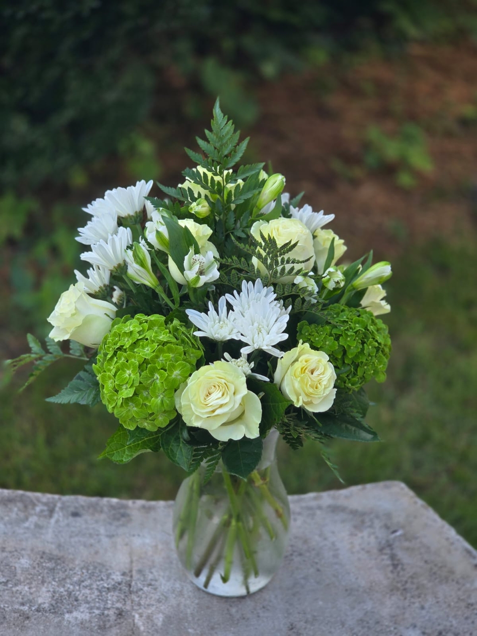 Fresh Elegance white and green flower arrangement with white rose, hydrangea and alstroemeria in a glass vase