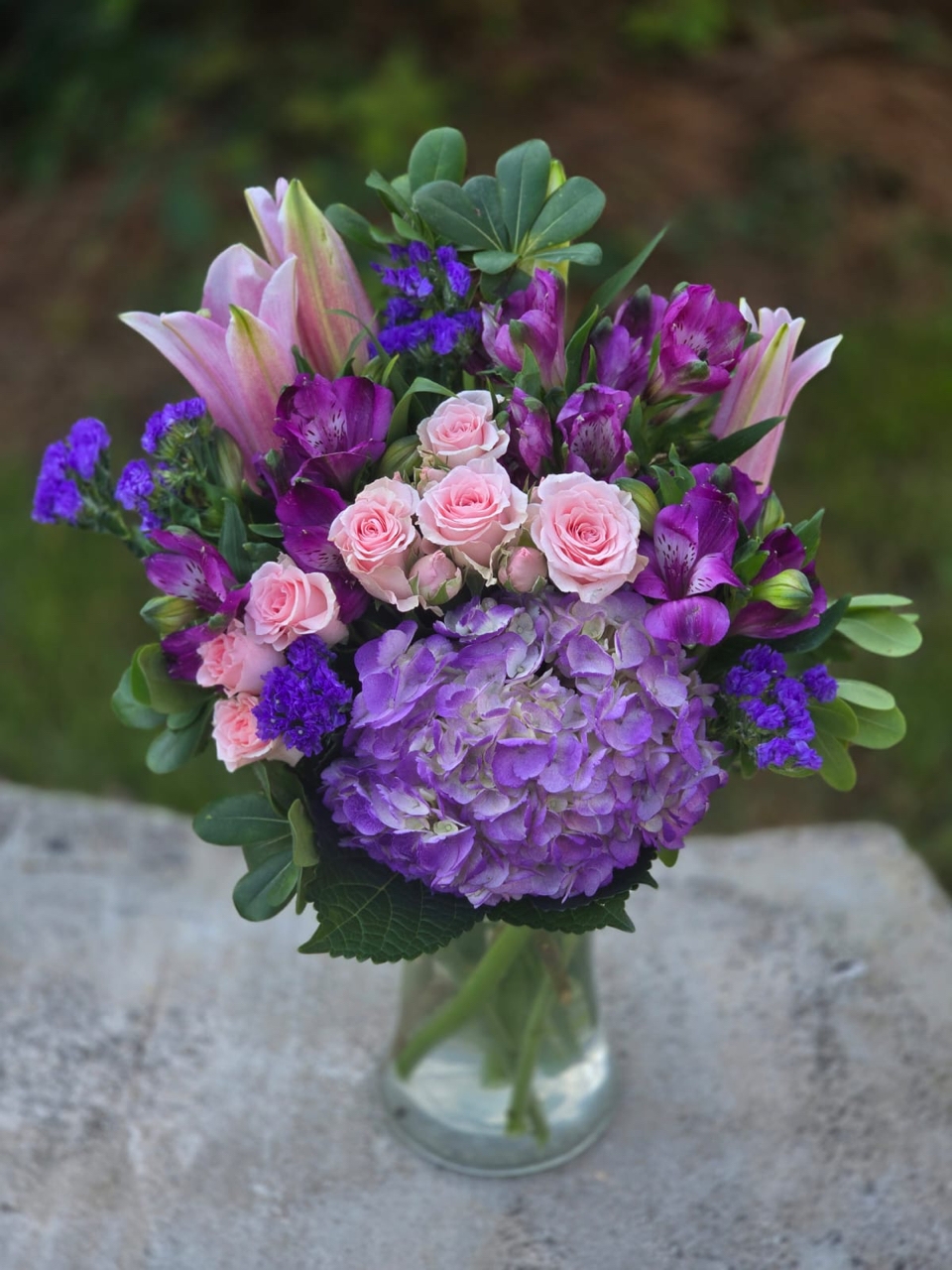 Luxury in every detail: a bouquet in a glass vase with lilac hydrangea, alstroemeria and pink lily - Image 2