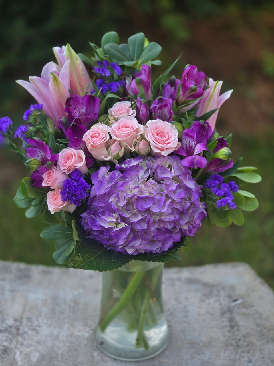 Luxury in every detail: a bouquet in a glass vase with lilac hydrangea, alstroemeria and pink lily - Image 4