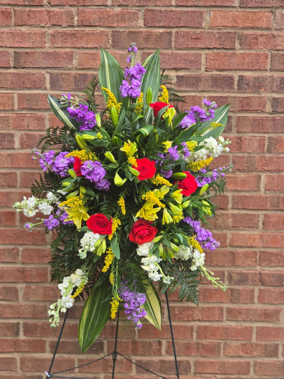 Funeral Standing Sprays & Wreaths with yellow lily, matthiola and red rose: a symphony of color