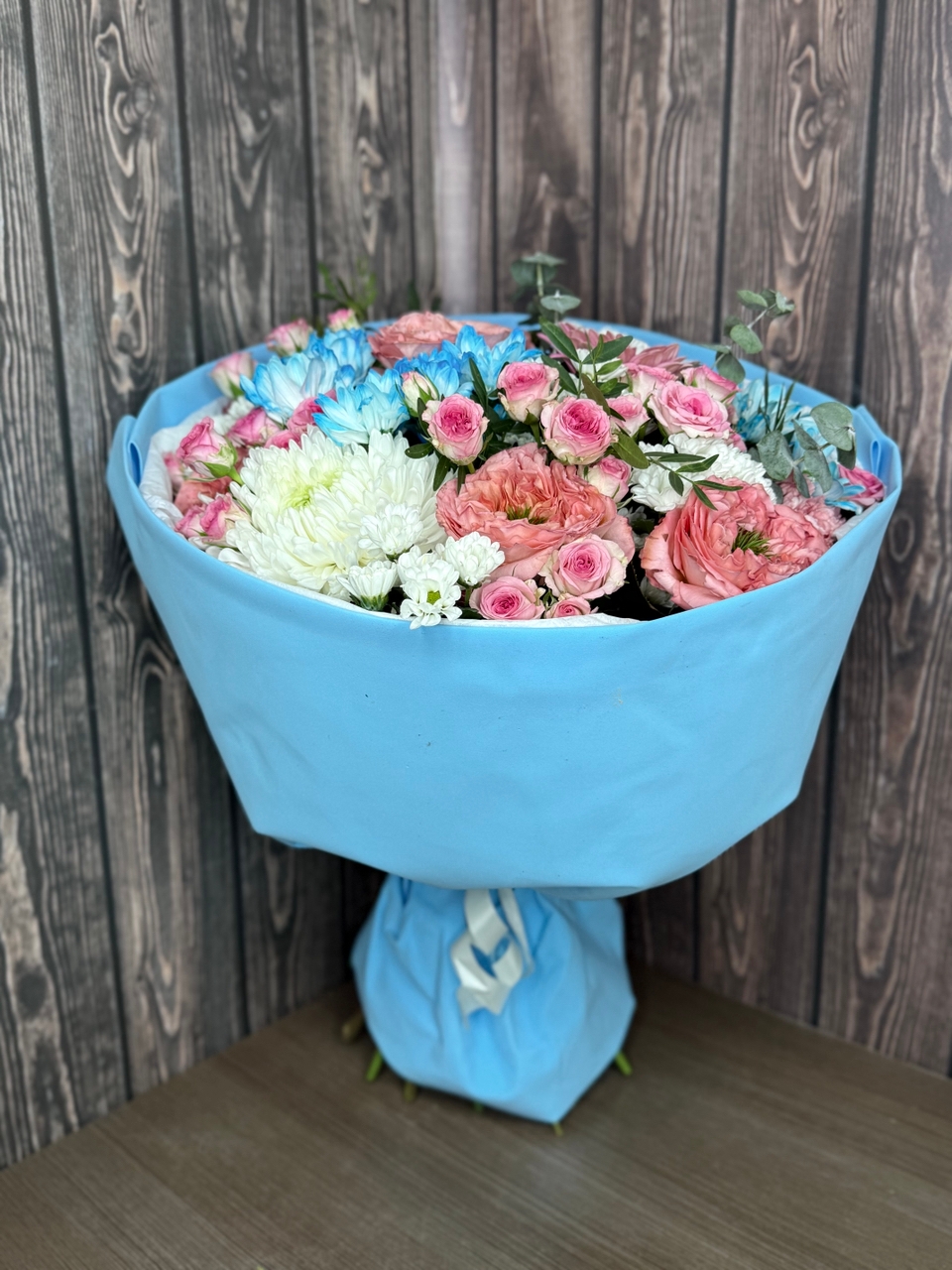 A bouquet with peony roses, chrysanthemums and eucalyptus in stylish packaging - Image 3